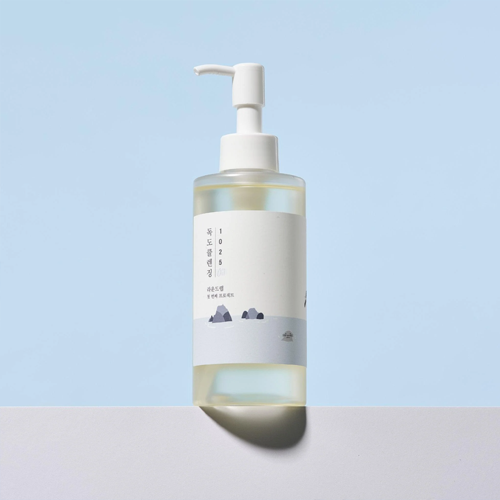 Round Lab 1025 Dokdo Cleansing Oil gently melting away makeup and impurities.