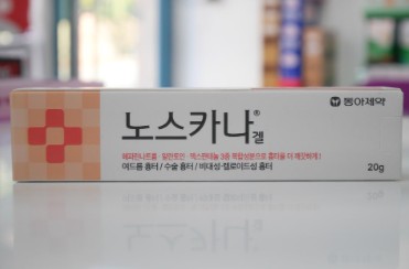 A tube of Dong-A Pharm's Noscarna Gel, a popular Korean pharmacy skincare item for acne scars.