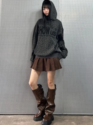 The 'K-student' look, with an oversized hoodie layered over a pleated skirt and paired with a beret.